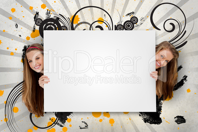 Pretty girls holding blank advertisement space