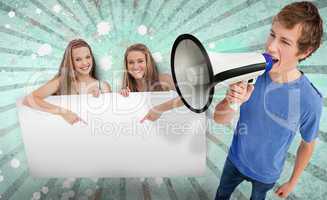 Pretty girls pointing to copy space with young man shouting thro
