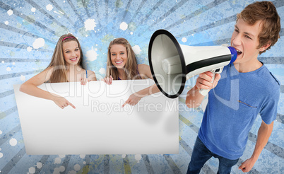 Pretty girls pointing to blank card with young man shouting thro