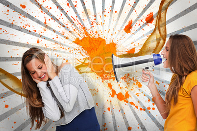 Girl shouting at her friend through a megaphone