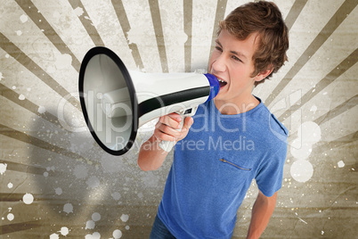 Young man shouting through a megaphone