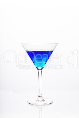 Cocktail glass with blue alcohol