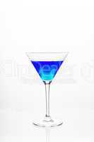 Cocktail glass with blue alcohol