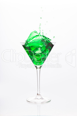 Cocktail glass with green alcohol