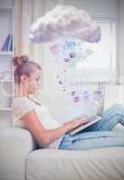 Attractive young woman connecting to cloud computing at home