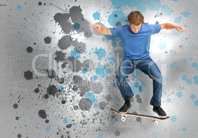 Male skateboarder doing an ollie trick