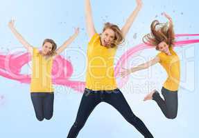 Three of the same young woman jumping for joy
