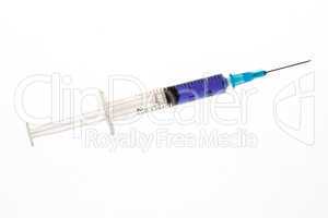 Hypodermic needle with purple liquid