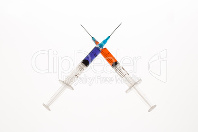 Two syringes crossing