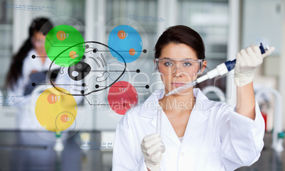Serious chemist working with colourful cell diagram inteface