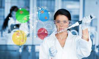 Serious chemist working with colourful dna helix diagram intefac