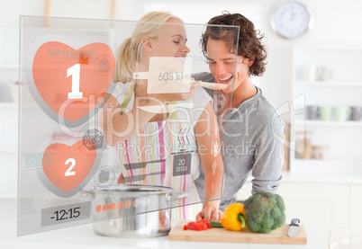 Cute couple making dinner using interface instructions