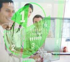 Business people using green pie chart interface