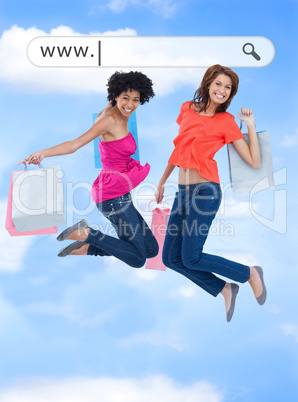 Happy girls jumping with their shopping bags under address bar