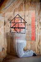 Man insulating walls following instructions on interface