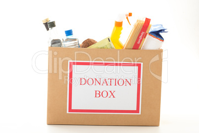 Cardboard donation box with houseware product and food