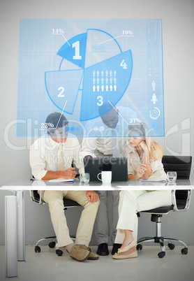 Three business people using blue pie chart interface