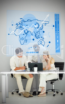 Three business people using blue map diagram interface