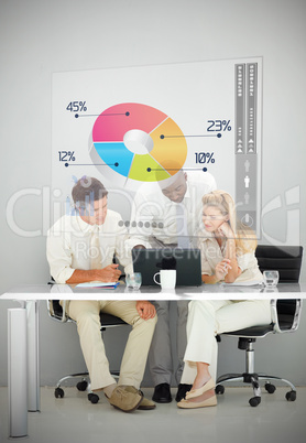 Three business people using colorful pie chart interface