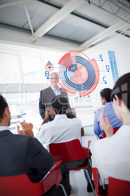 Business people clapping stakeholder standing in front of diagra