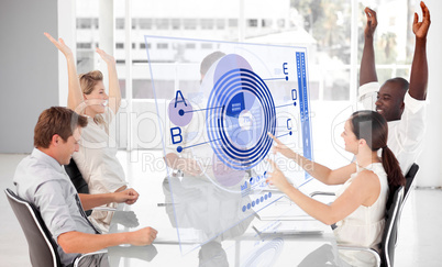 Cheerful business workers using blue diagram interface