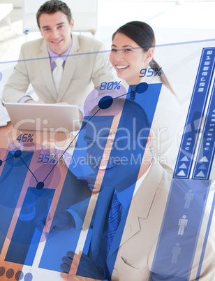 Overview of cheerful colleagues looking at blue chart futuristic