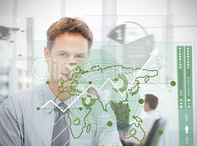 Businessman looking at green map interface