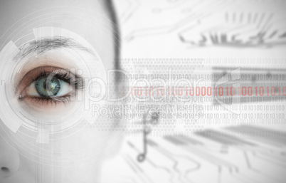 Close up of woman eye with futuristic interface showing binary c