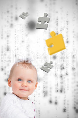 Jigsaw pieces floating around a baby