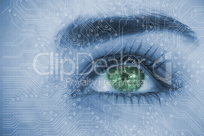 Close up of woman eye analyzing circuit board