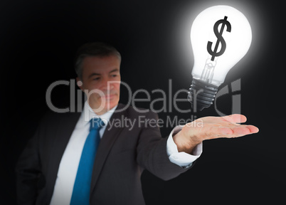 Businessman showing light bulb