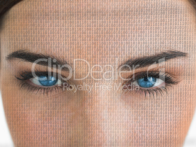 Attractive blue eyed woman with binary coding on face