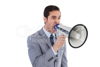 Businessman shouting into a megaphone