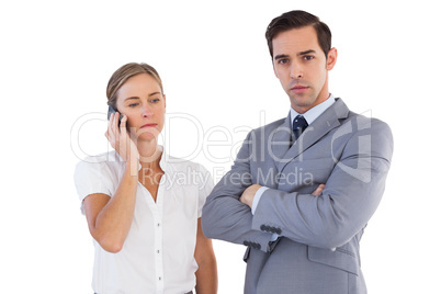 Businesswoman on the phone next to her colleague