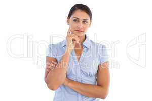 Serious businesswoman with her hand touching her face