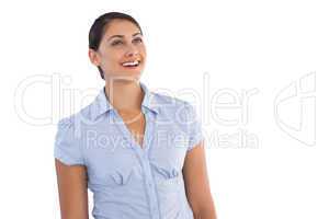 Smiling young businesswoman standing alone