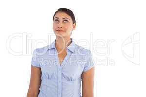 Thoughtful businesswoman standing alone