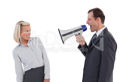 Businessman shouting at colleague with his megaphone