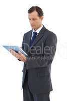 Charismatic businessman holding a tablet pc