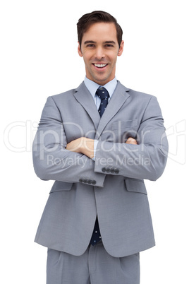 Cheerful businessman with arms folded