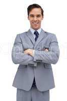 Cheerful businessman with arms folded