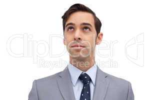 Young businessman looking up