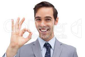 Successful businessman giving ok sign