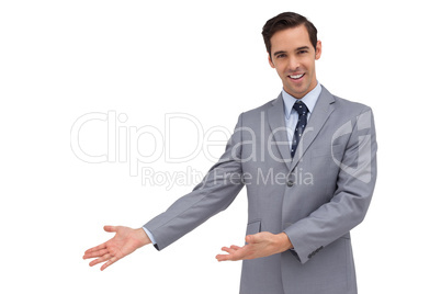 Smiling businessman giving a presentation with his hands
