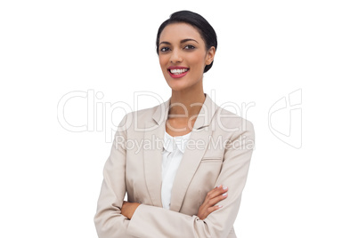 Cheerful businesswoman with arms crossed