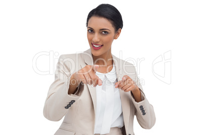 Young business woman is pointing out the camera