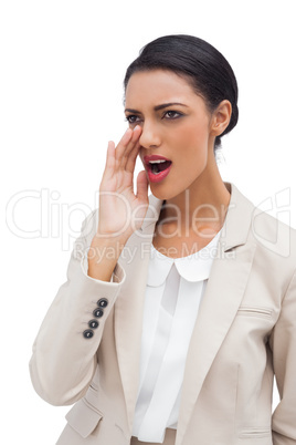 Standing businesswoman calling for someone