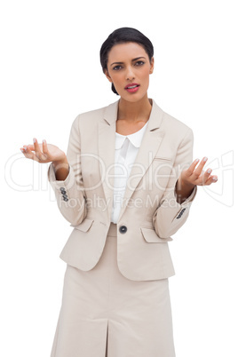 Confused businesswoman standing