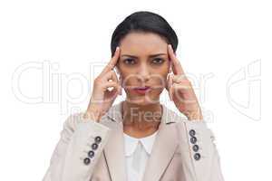 Businesswoman putting her fingers on her temples