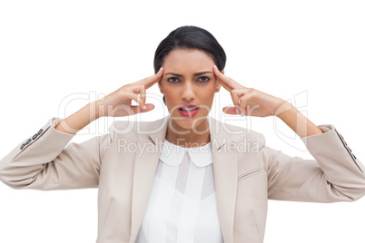 Concentrated businesswoman putting her fingers on her temples